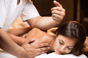 The girl enjoys deep tissue massage